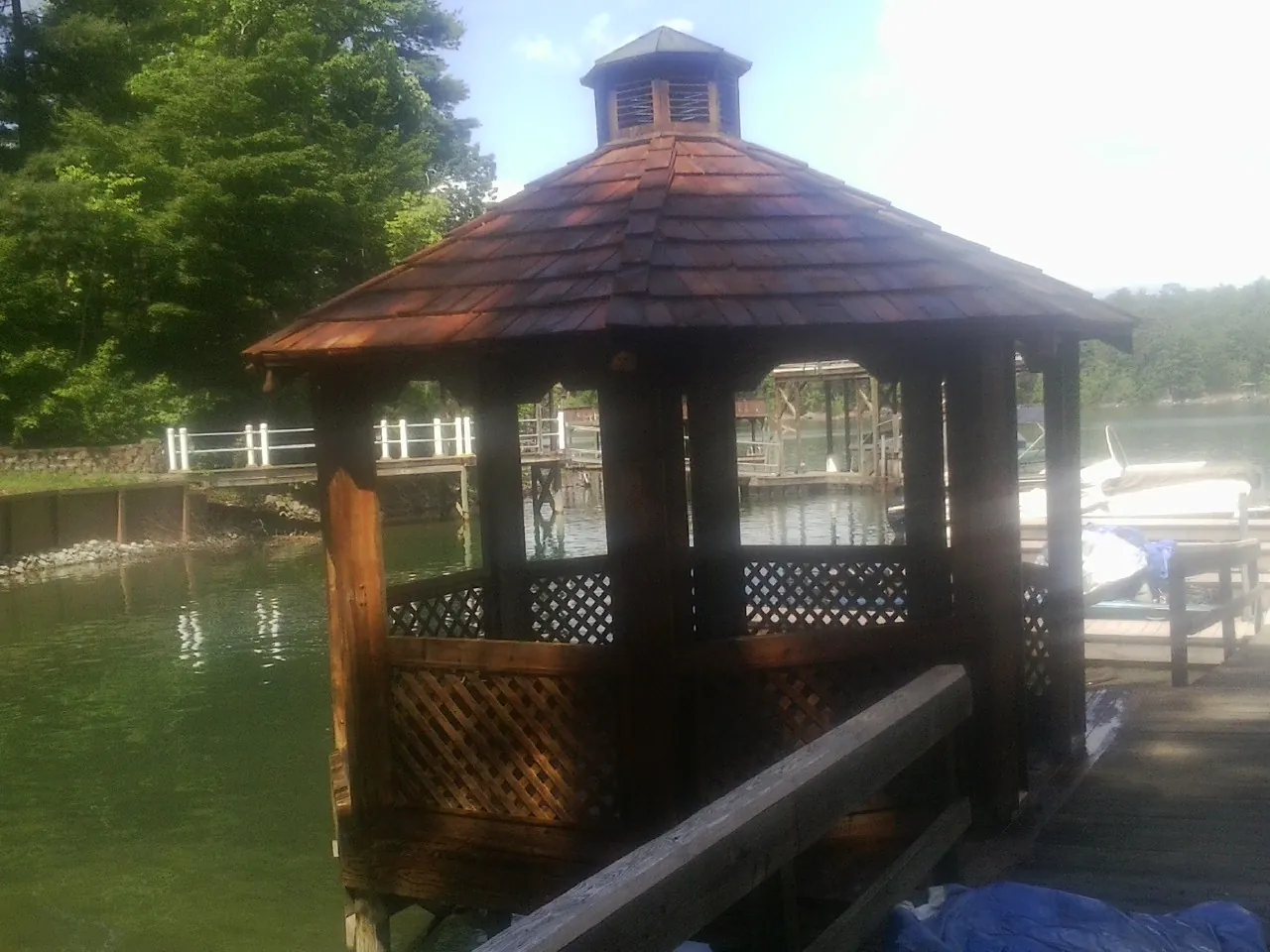 Cedar shake gazebo roof rebuilt on a lake dock in South Otselic